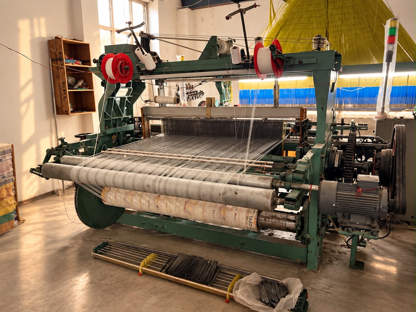 Loom weaving silk threads in a Banaras weaving unit